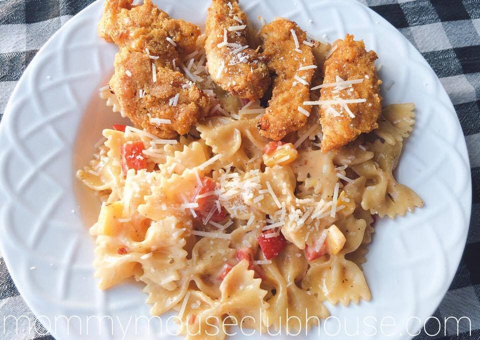 Cheesecake Factory's Louisiana Chicken Pasta in a white bowl on a black and white background.