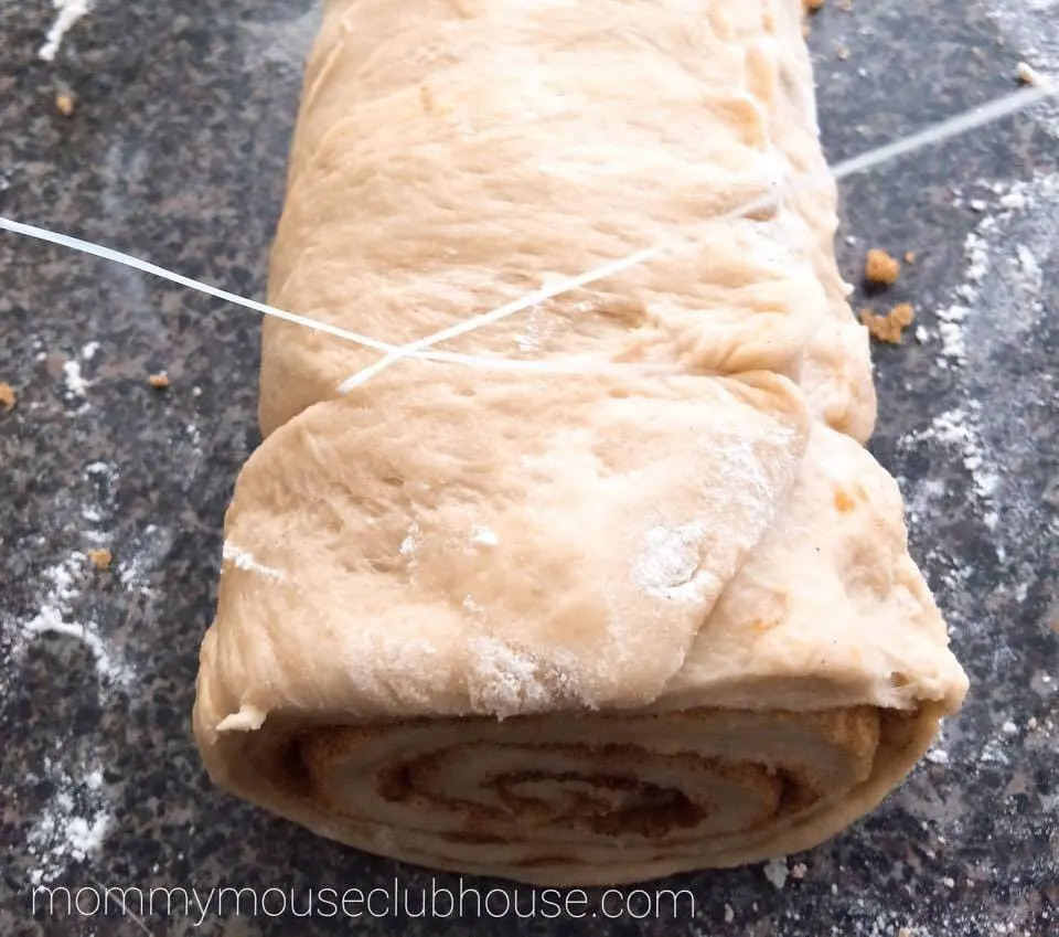 Dental floss cutting Cake Mix Cinnamon Rolls dough into rolls.