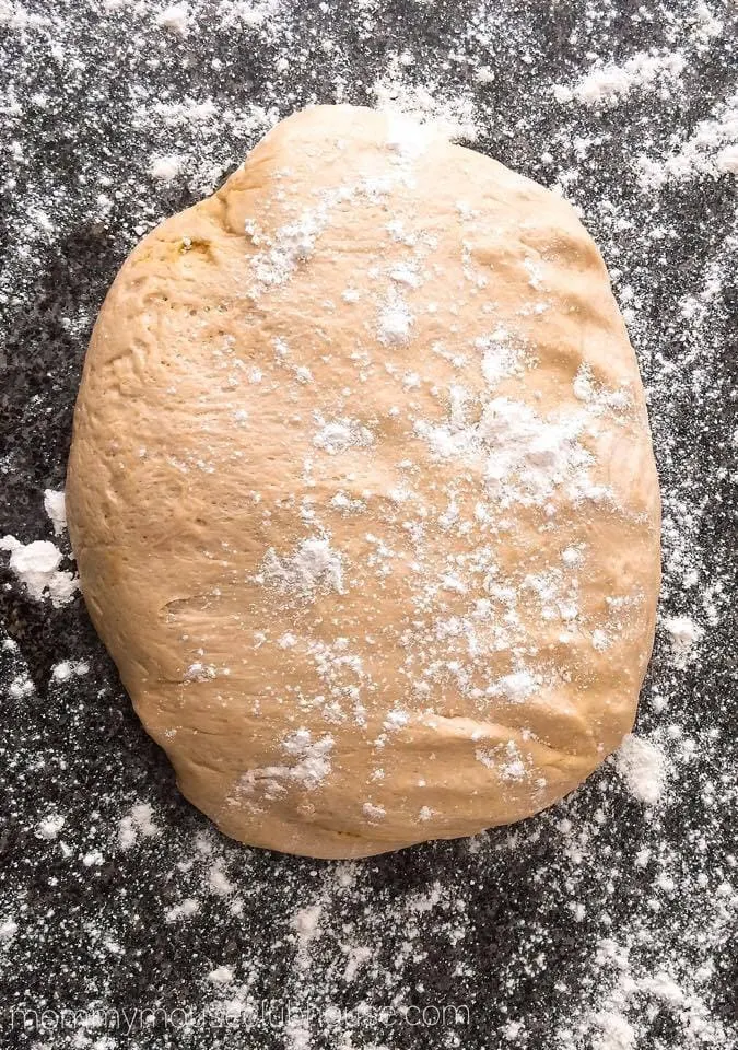 Cake Mix Cinnamon Rolls dough on a floured surface.