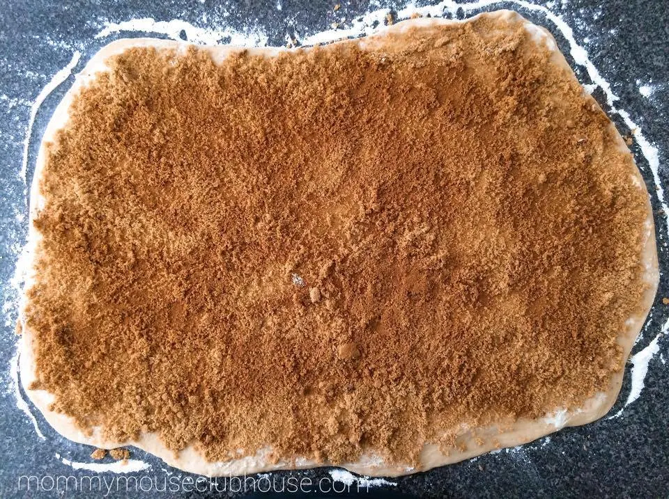Cake Mix Cinnamon Rolls dough sprinkled with brown sugar and cinnamon.