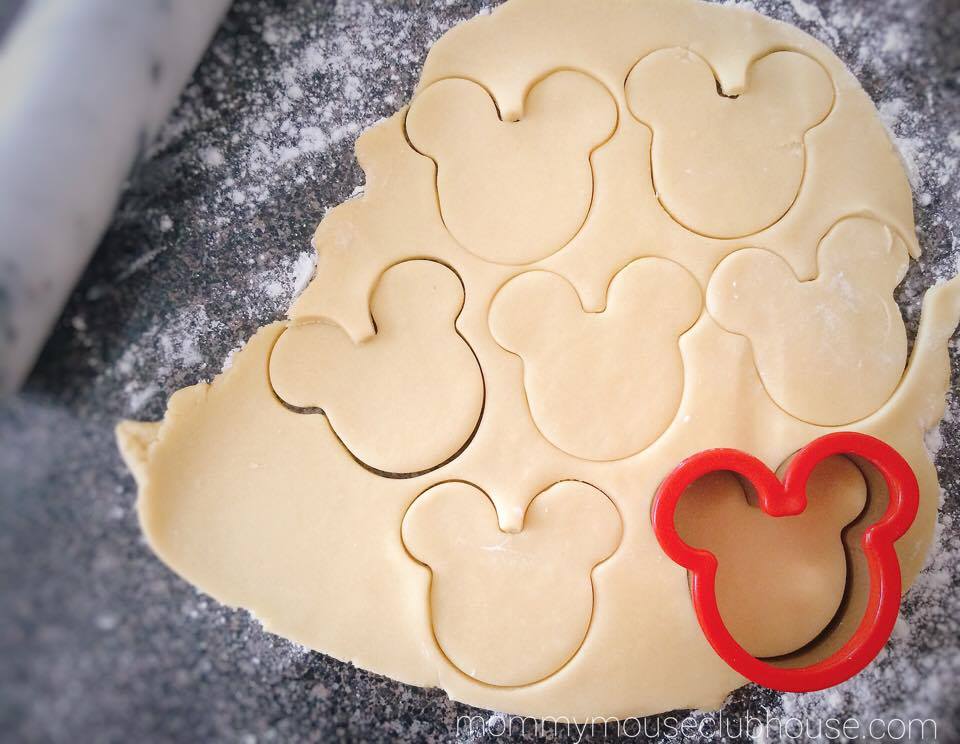 The BEST Sugar Cookie Recipe dough rolled out with a Mickey Mouse cookie cutter.