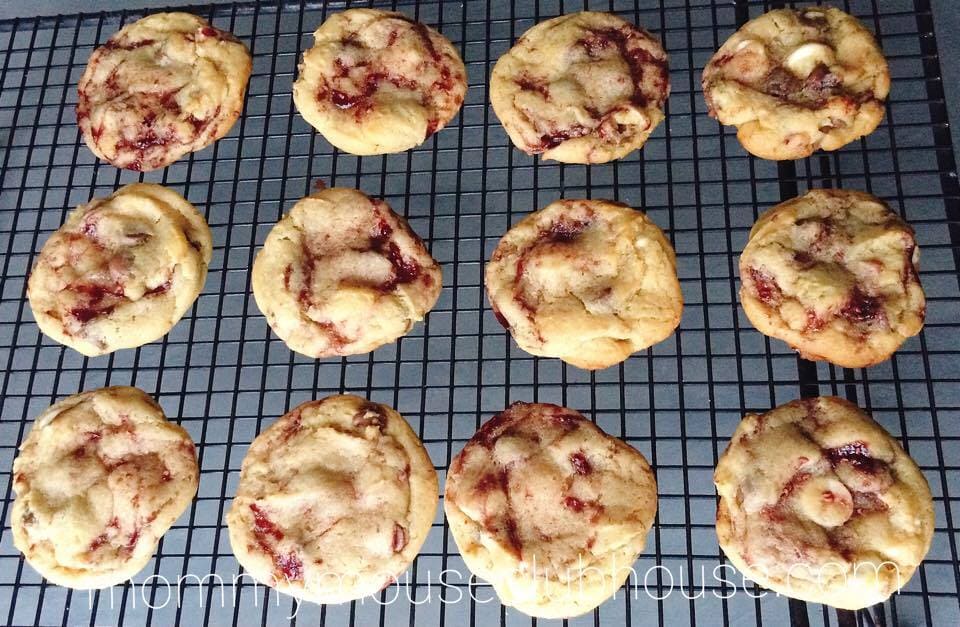 Freshly bakedDisneyland's Raspberry White Chocolate Chip Cookies on a cooling rack