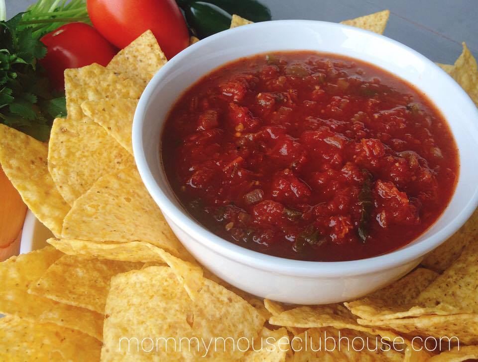 Homemade Restaurant Style Salsa in a dish with tortilla chips on the side.