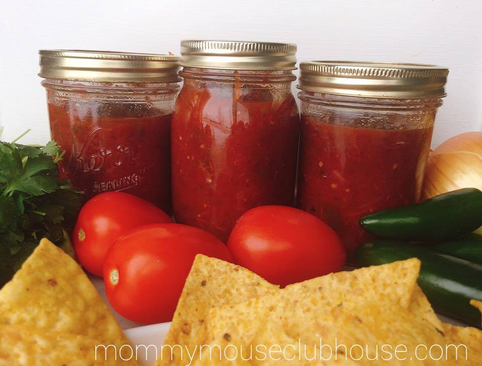 Three jars of Homemade Restaurant Style Salsa with tomatoes, jalapeños, and tortilla chips.