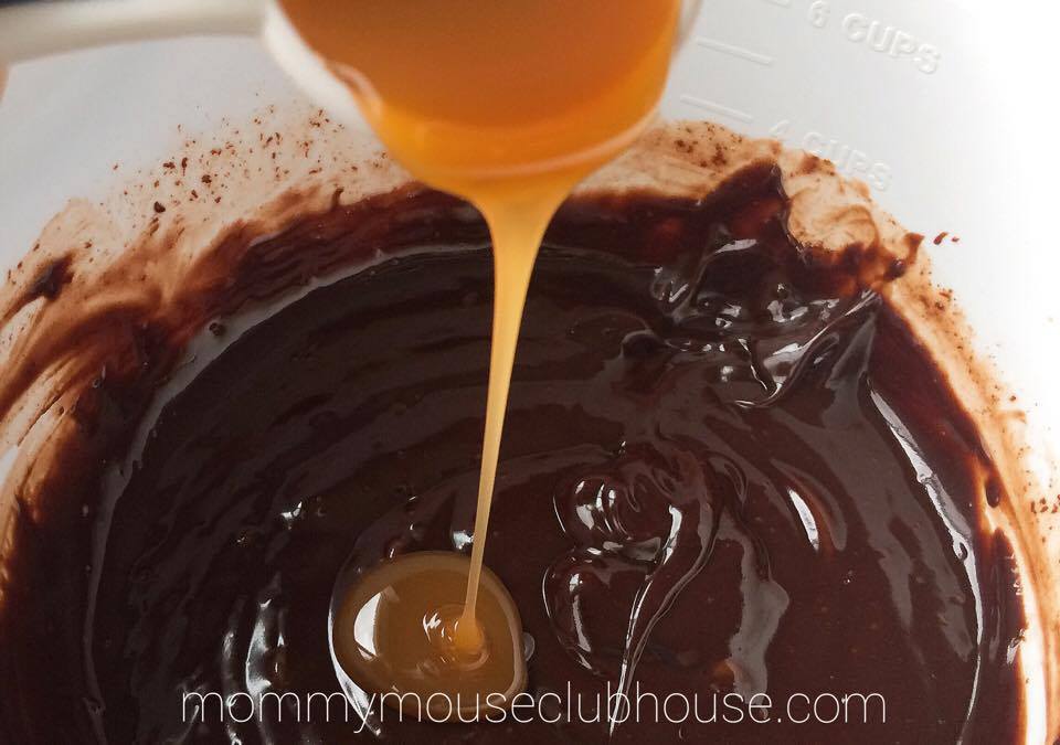 Step two to make salted caramel ganache pour caramel into the melted chocolate mixture to make Chocolate Salted Caramel Cupcakes