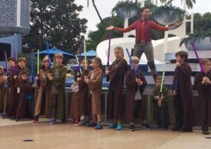 Children on a stage training to be a Jedi