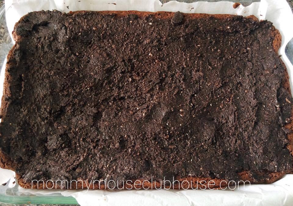 Thin Mint truffle layer spread over the brownie batter layer to make Thin Mint Brownies