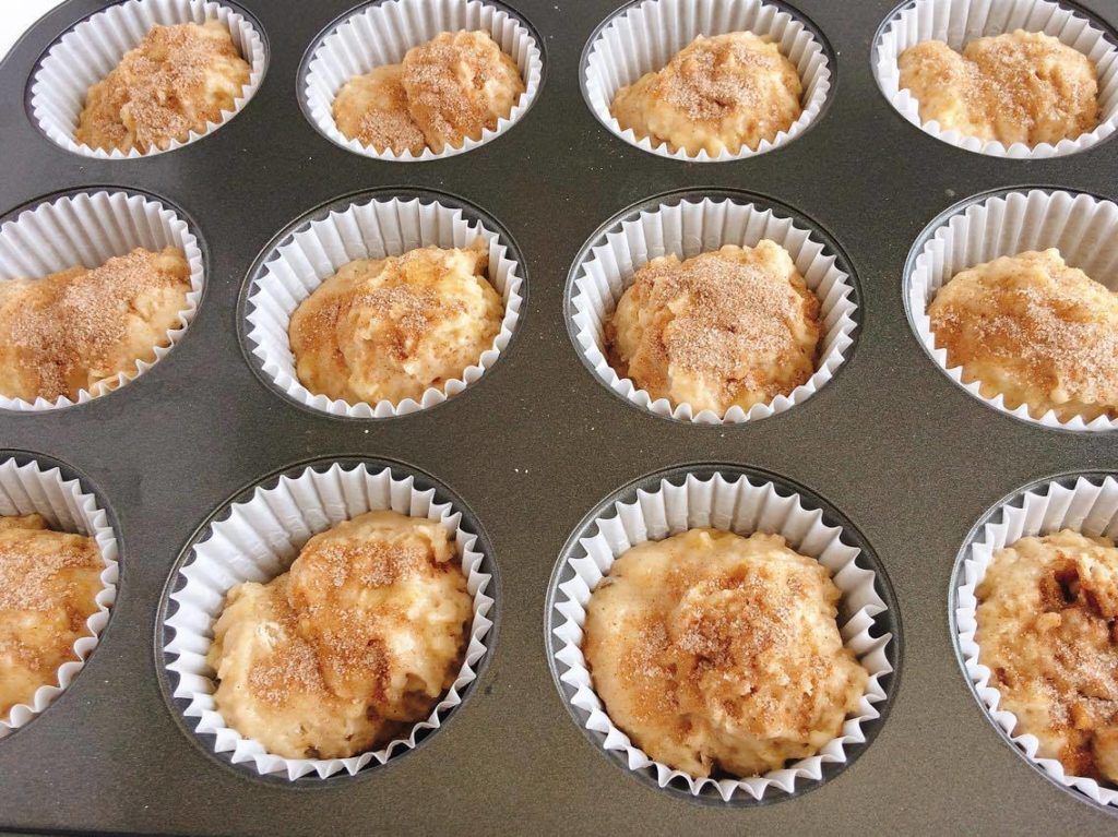 Easy Cinnamon Swirl Banana Bread Muffins batter in a muffin pan.