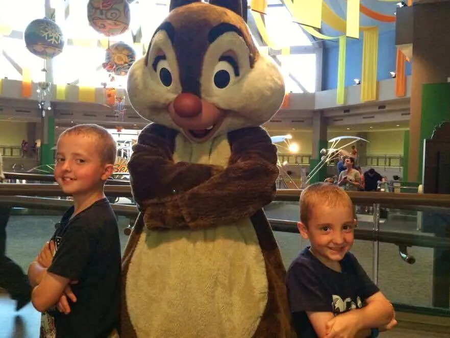 Two boys posed with Chip and Dale at Epcot