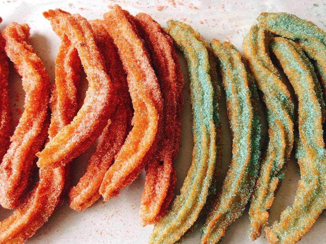 Homemade Disney Churros dusted with red and blue sugar to look like light saber churros.