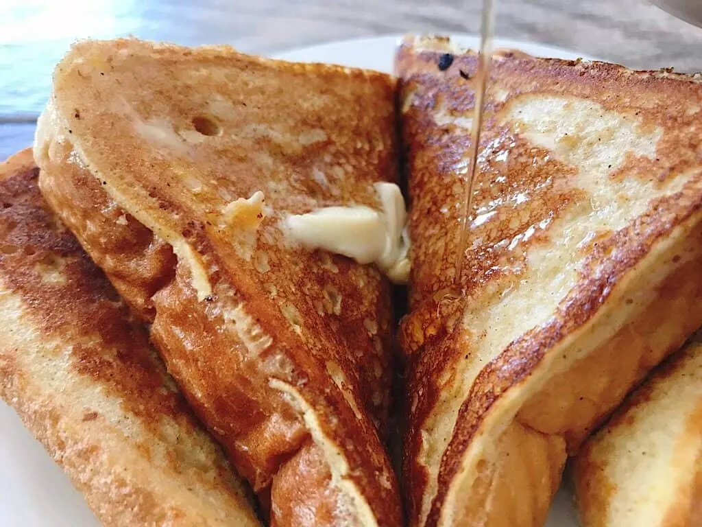 Slices of French toast with butter and syrup