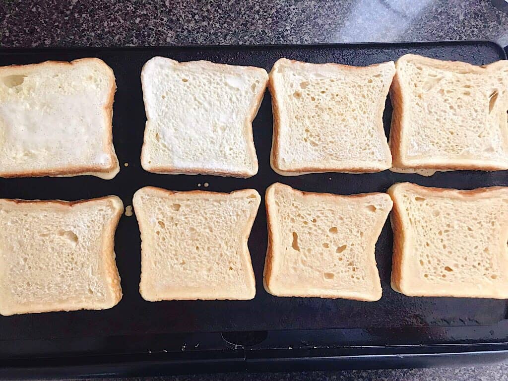 French toast cooking on a griddle