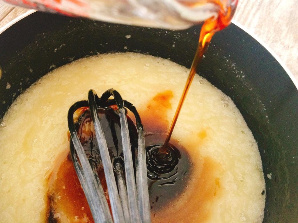 Corn syrup being poured into a pan to make Dark Chocolate Pecan Pie