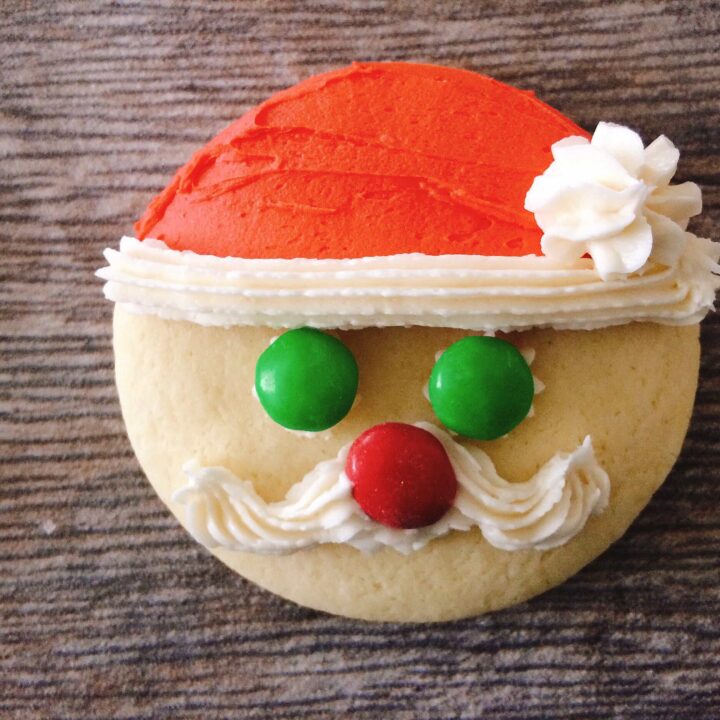 A sugar cookie frosted to look like Santa Claus