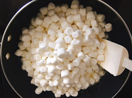 Marshmallows in a pan melting for Leprechaun Rice Krispie Treats