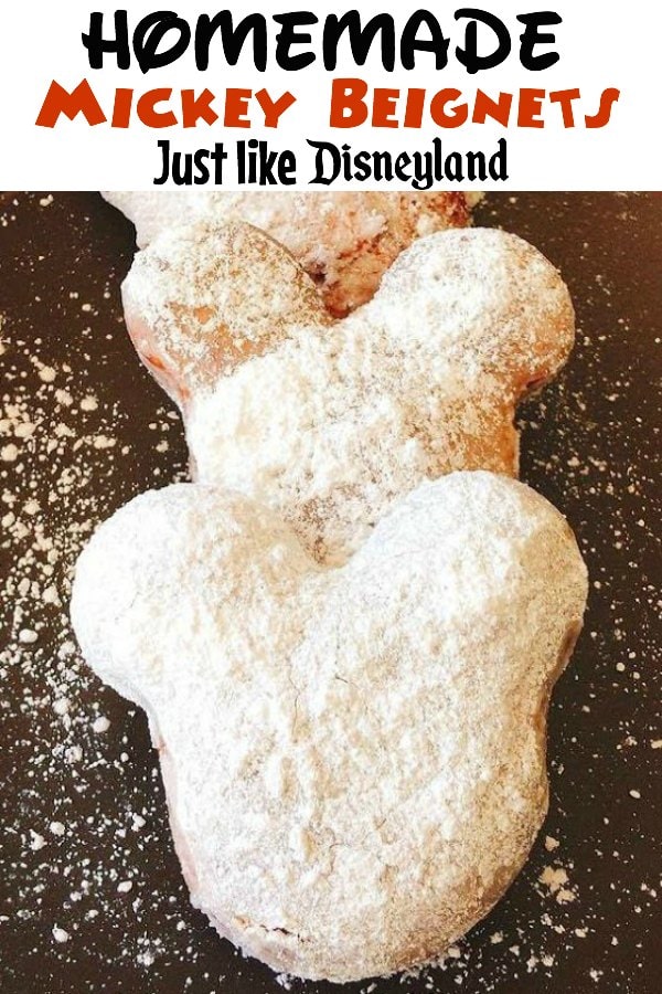 "Homemade Mickey Beignets Just like Disneyland" over a picture of 3 Mickey shaped beignets covered in powdered sugar.