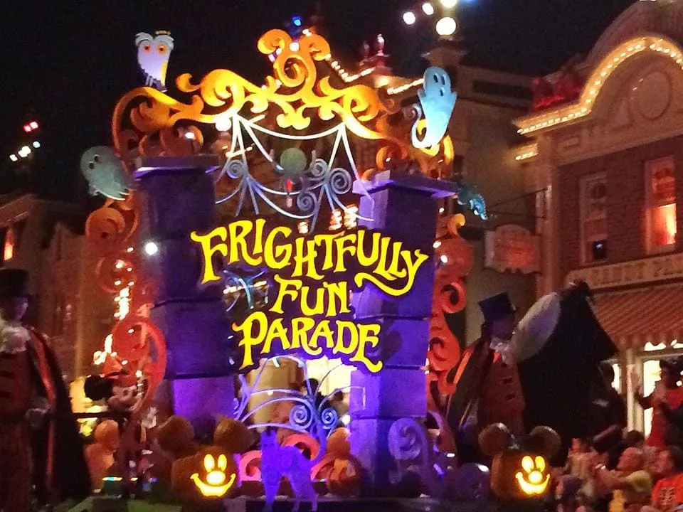 A parade float at Mickey's Halloween Party at Disneyland that says "Frightfully Fun Parade"