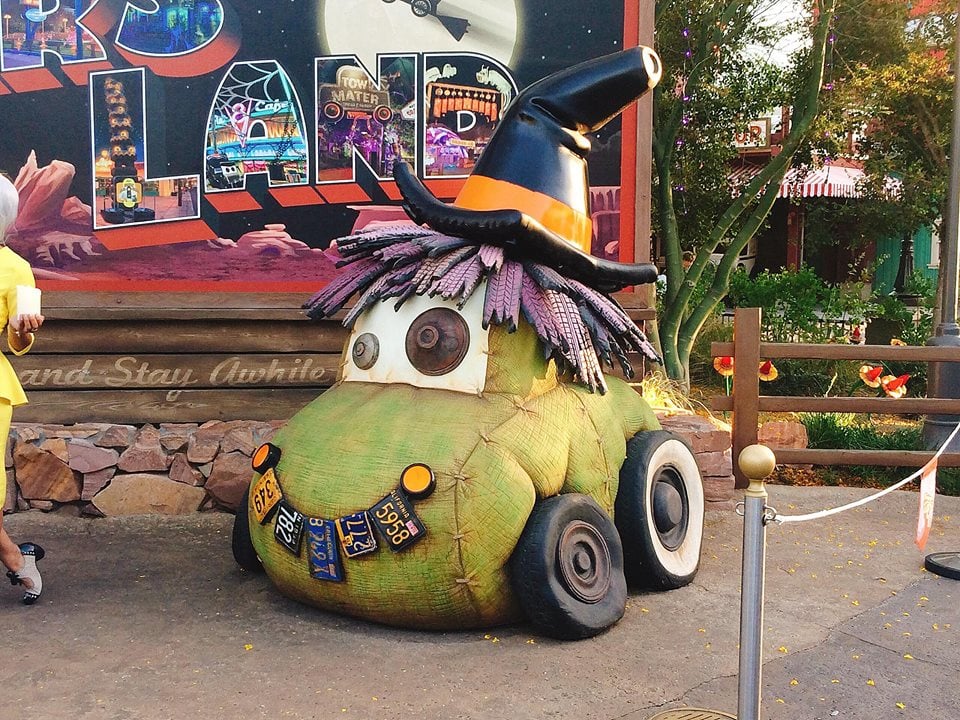 A car dressed as a witch in front of Cars Land at Disneyland.