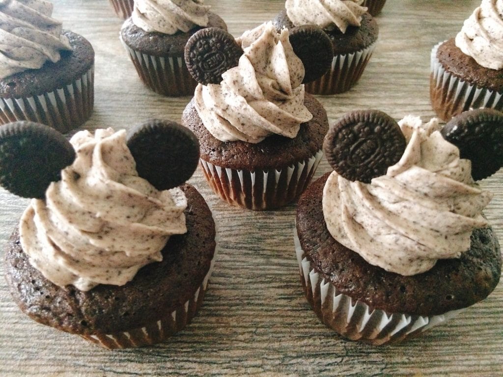 Chocolate cupcakes with Oreo frosting and small Oreos to make Mickey Mouse Ears.