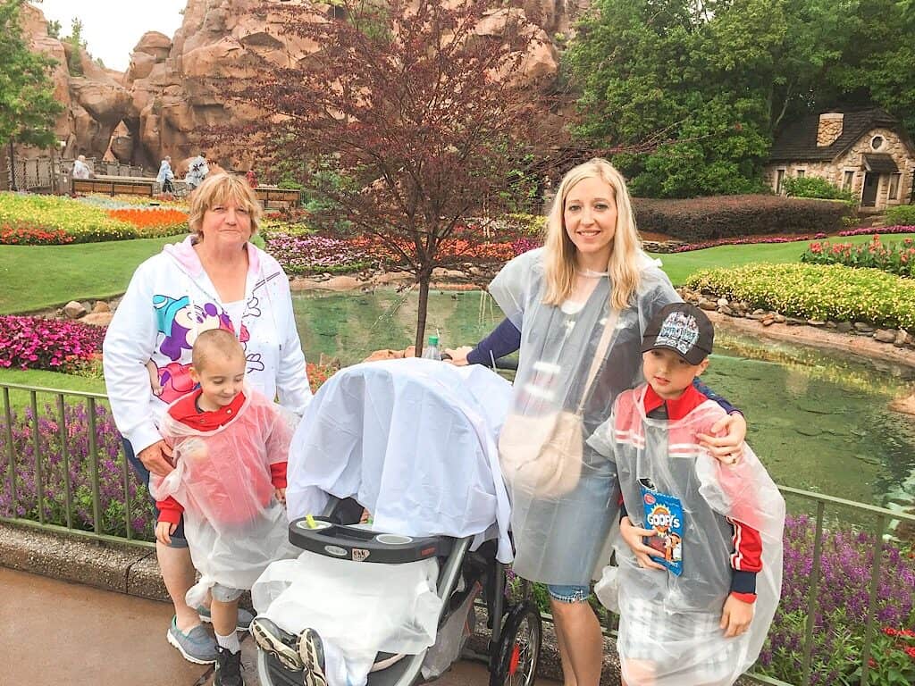 A family in the rain at Epcot