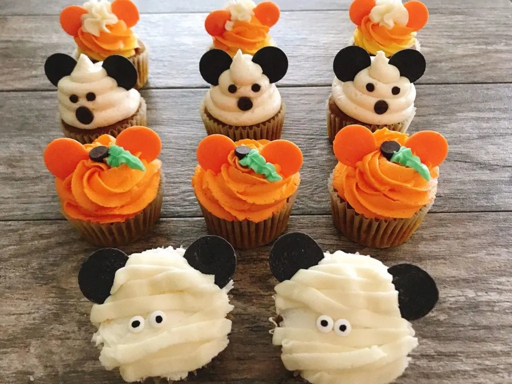 Four different types of Mickey Mouse Halloween Cupcakes.