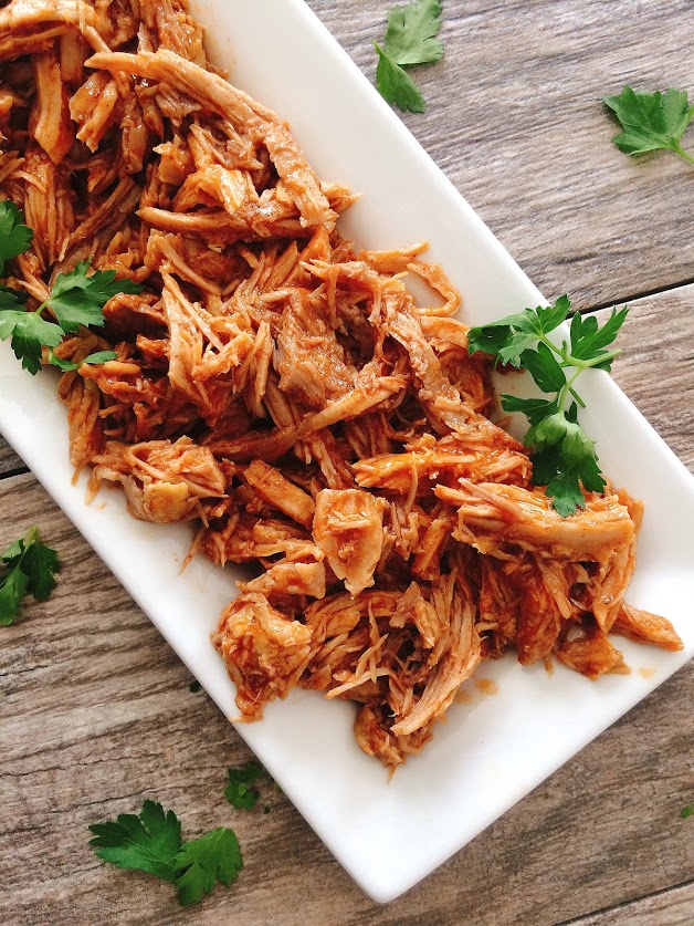 A plate of pulled Sweet Pork Barbacoa like Cafe Rio, sprinkled with cilantro.