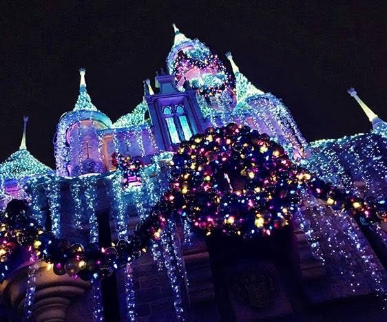 Christmas lights decorating Sleeping Beauty Castle for Christmas at Disneyland.