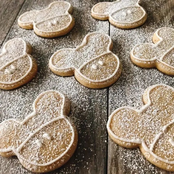 Mickey Mouse shaped gingerbread sugar cookies dusted with powdered sugar.