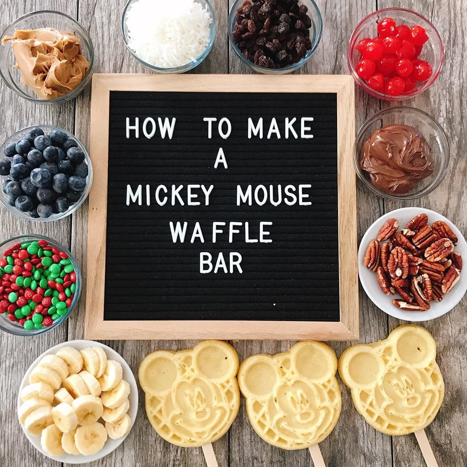 Waffle bar toppings and Mickey Mose Waffles around a sign that says "How to Make a Mickey Mouse Waffle Bar". #wafflebar #waffles #mickeymouse #disney #disneyrecipe #wafflebarideas #wafflebartoppings