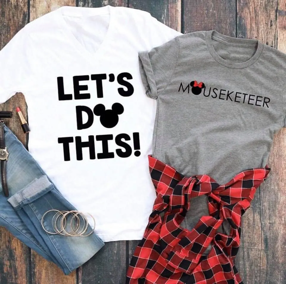 Two Disney shirts. A white shirt with text "Let's Do This!" and a grey shirt with text "Mouseketeer".