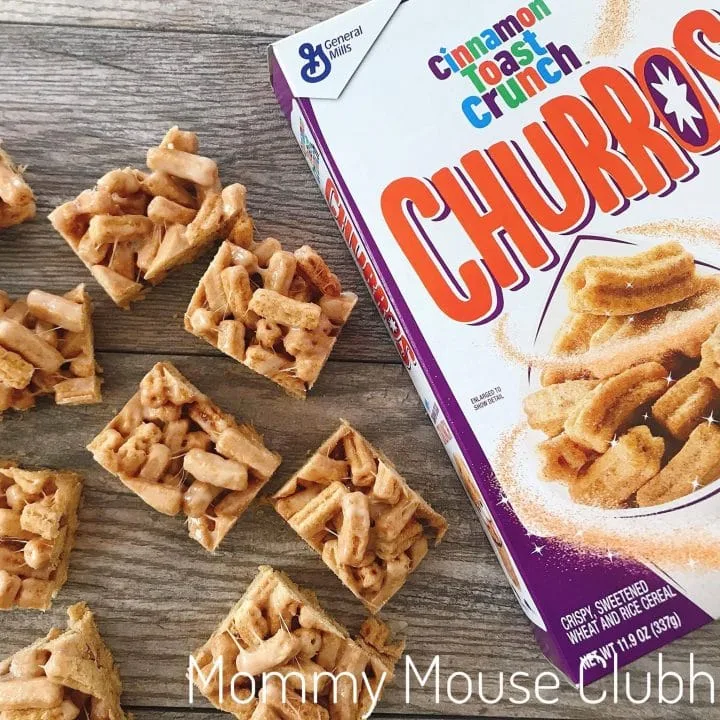 Churro Cereal Treats cut into squares next to a box of Cinnamon Toast Crunch Churros.