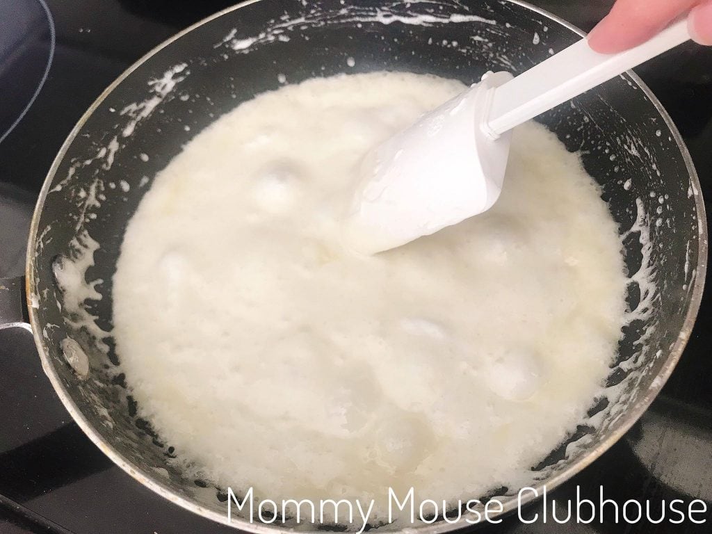 A spoon stirring melted marshmallows.