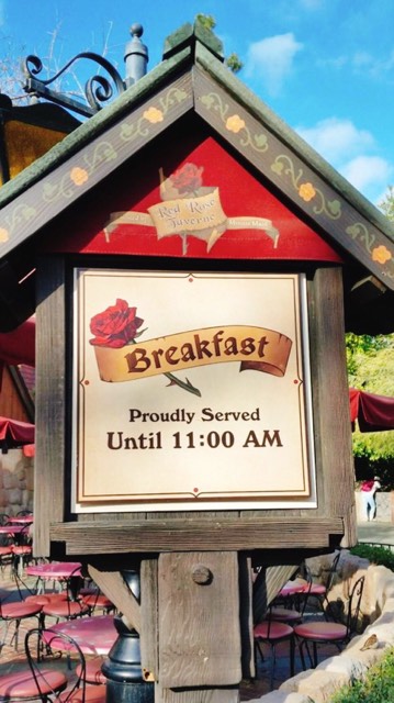 The sign for Red Rose Tavern at Disneyland that says "Breakfast Proudly Served Until 11:00 AM"