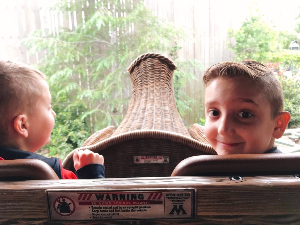 Two kids riding on a rollercoaster called “Flight of the Hippogriff” at the Wizarding World of Harry Potter at Universal Studios Hollywood.