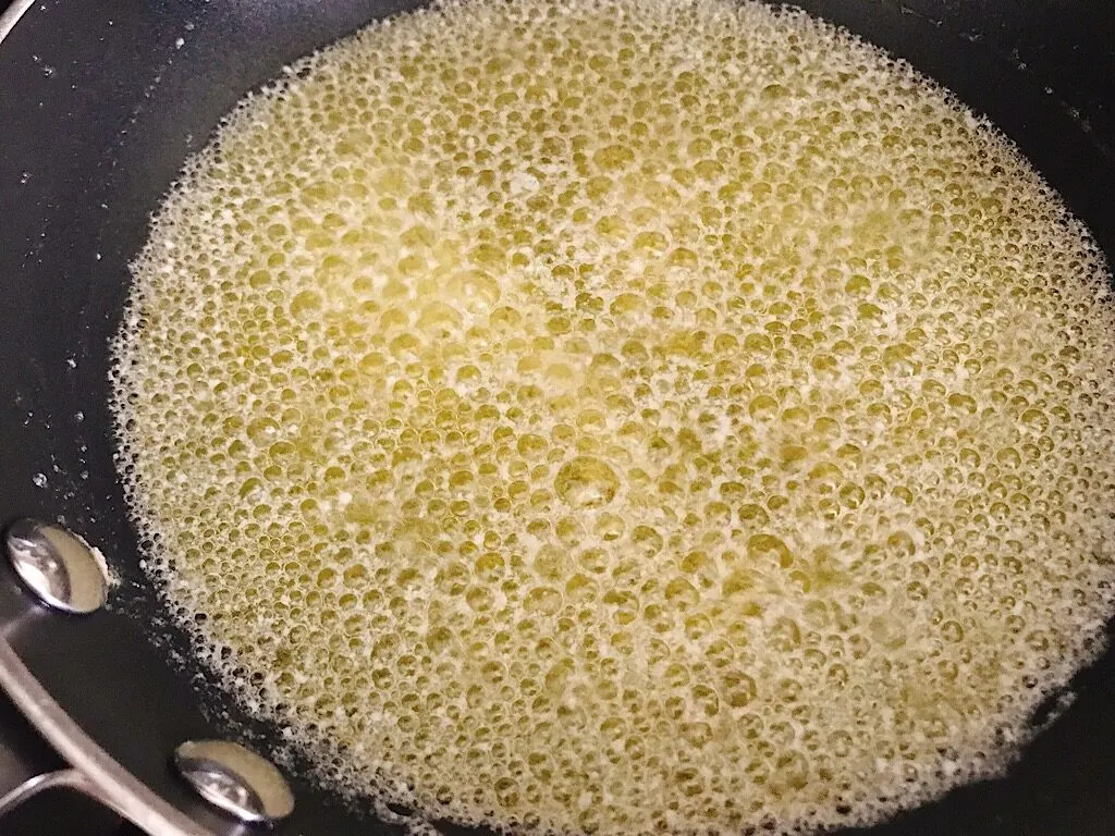 A pan of boiling butter,