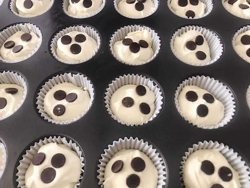 A close up view of low carb cheesecake cupcakes with chocolate chips.