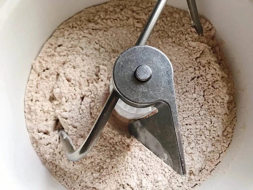 Dry ingredients for Red Velvet Cake Mix Cinnamon Rolls in a Bosch mixer