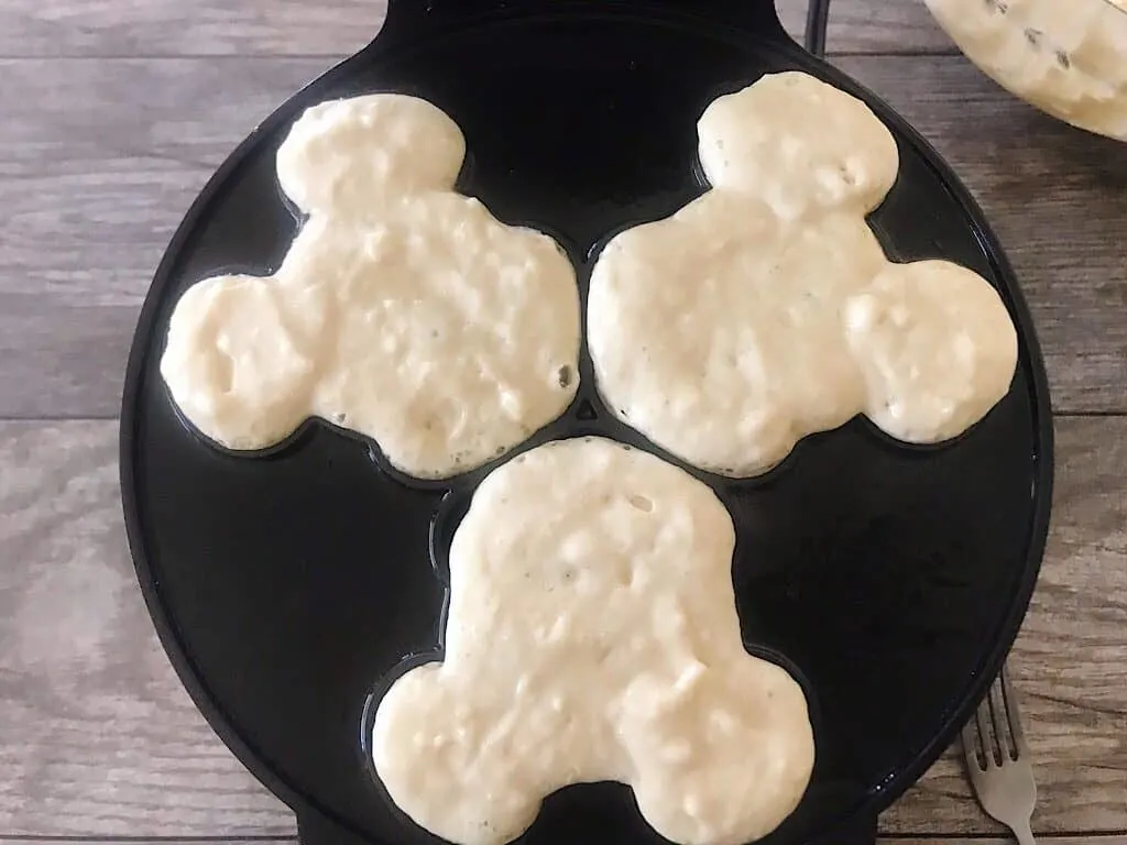 Crispy waffles in a Mickey Mouse waffle iron.