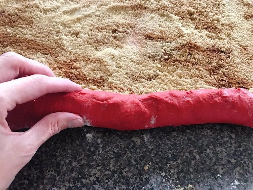 Dough being rolled into a roll