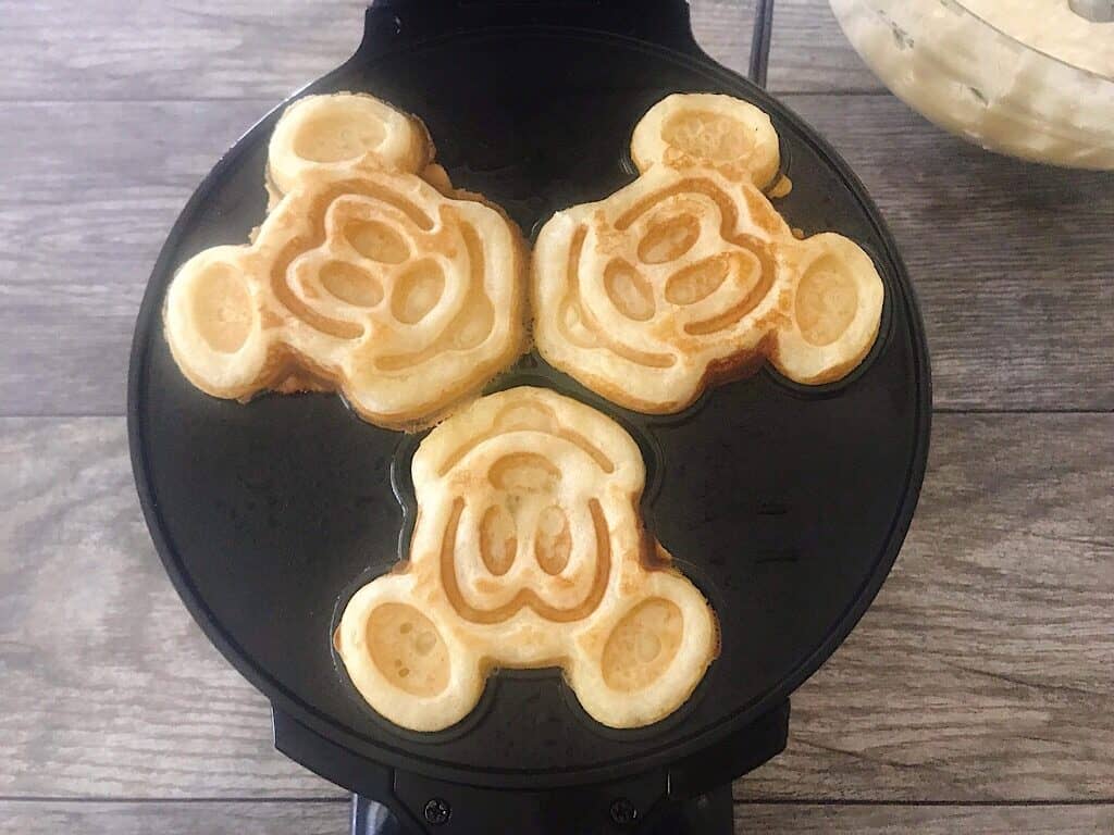 Crispy waffles in a Mickey Mouse waffle iron.