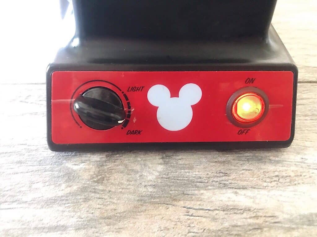 The control buttons of a Mickey Mouse waffle iron.