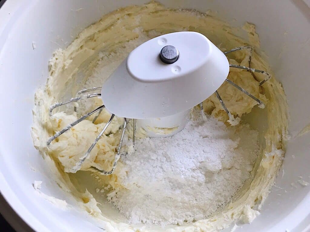 Powdered sugar in a bowl to make cream cheese frosting