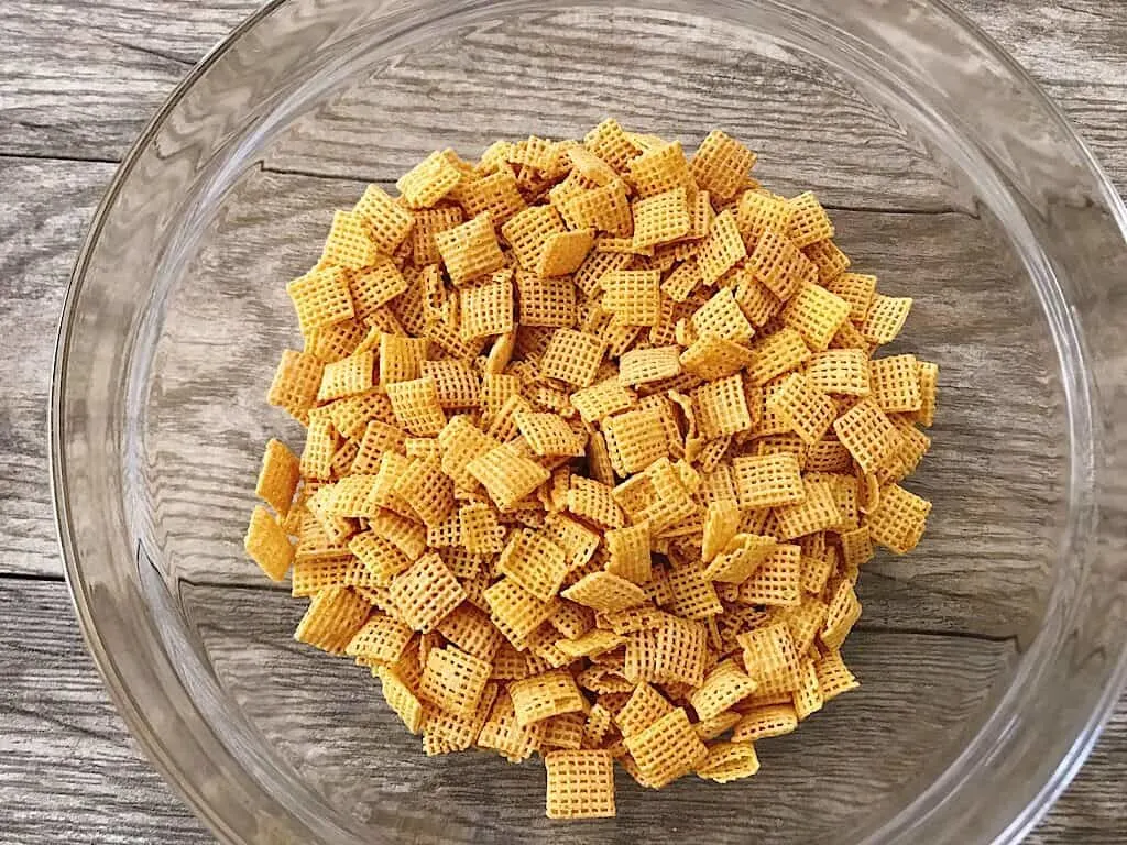 A glass bowl of Chex cereal.
