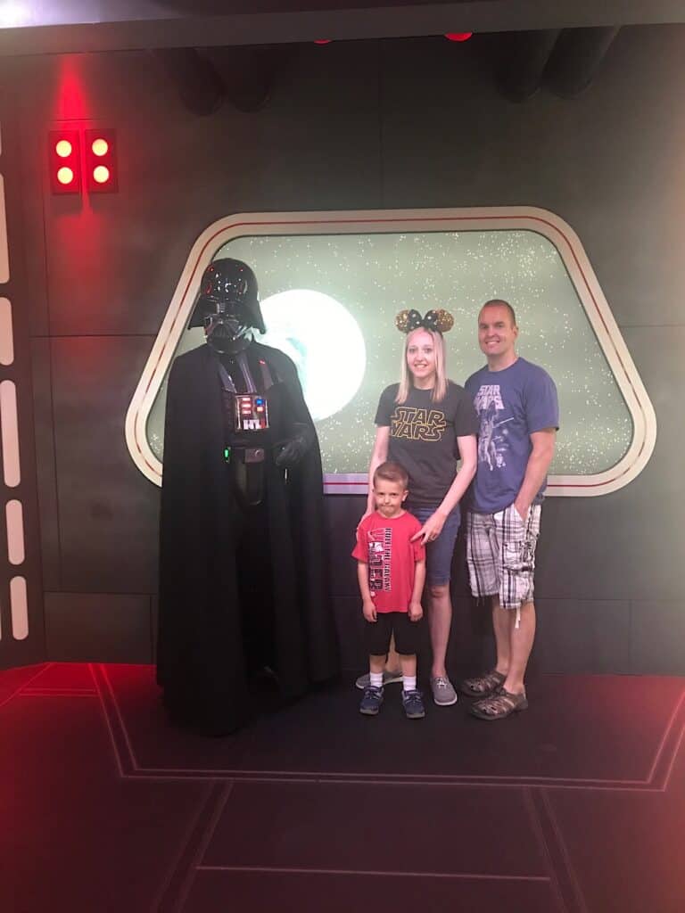 Darth Vader with a Mom, Dad, and little boy at Disneyland.