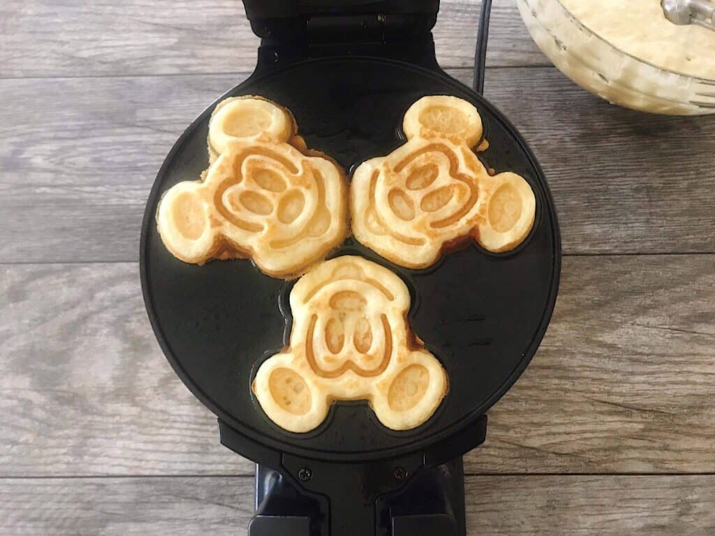 Crispy waffles in a Mickey Mouse waffle iron.