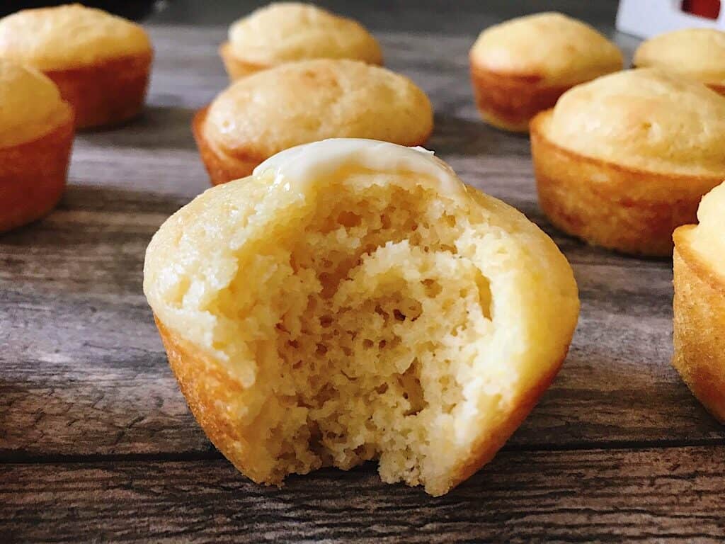 Cornbread Muffins topped with butter.