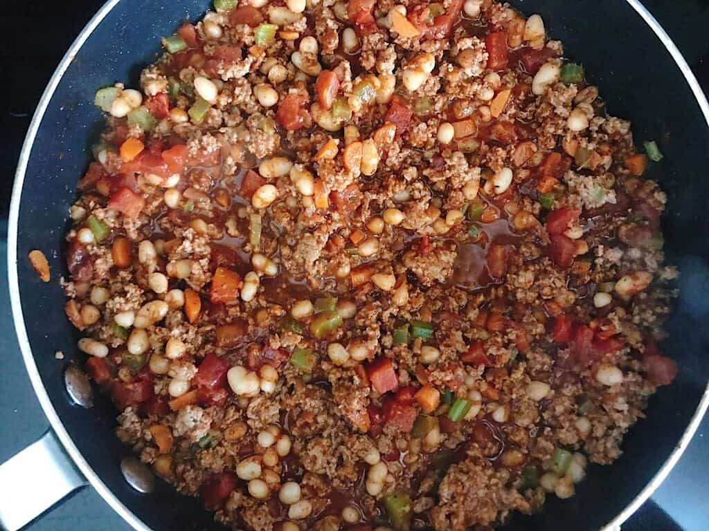 Buffalo Chicken Chili simmering in a pan