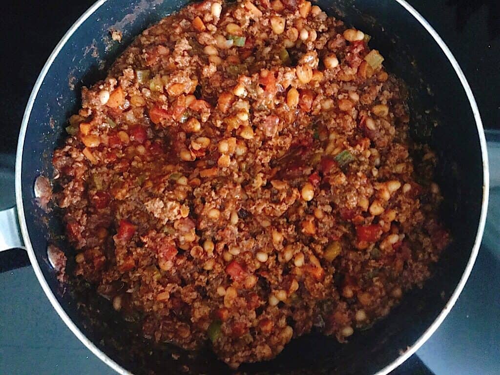 Buffalo Chicken Chili simmering in a pan.