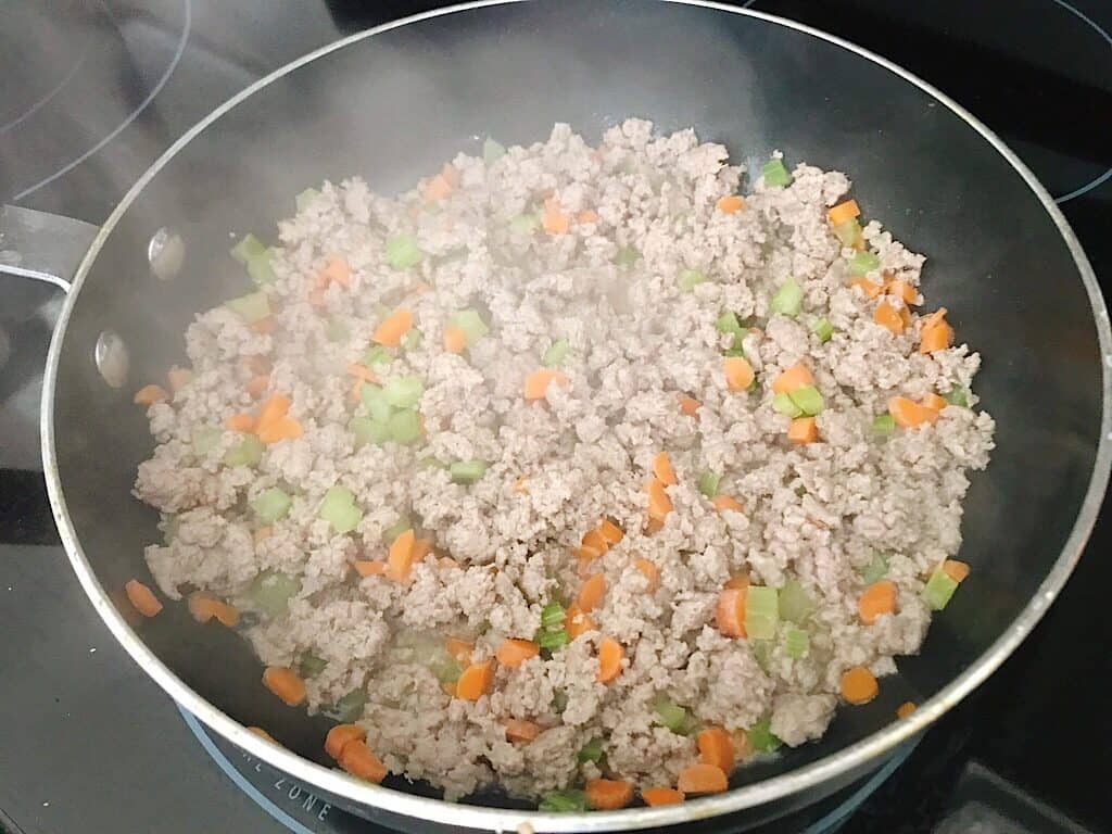 Ground chicken and vegetables to make Buffalo Chicken Chili