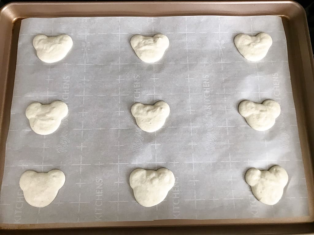 Mickey Macarons on a baking sheet